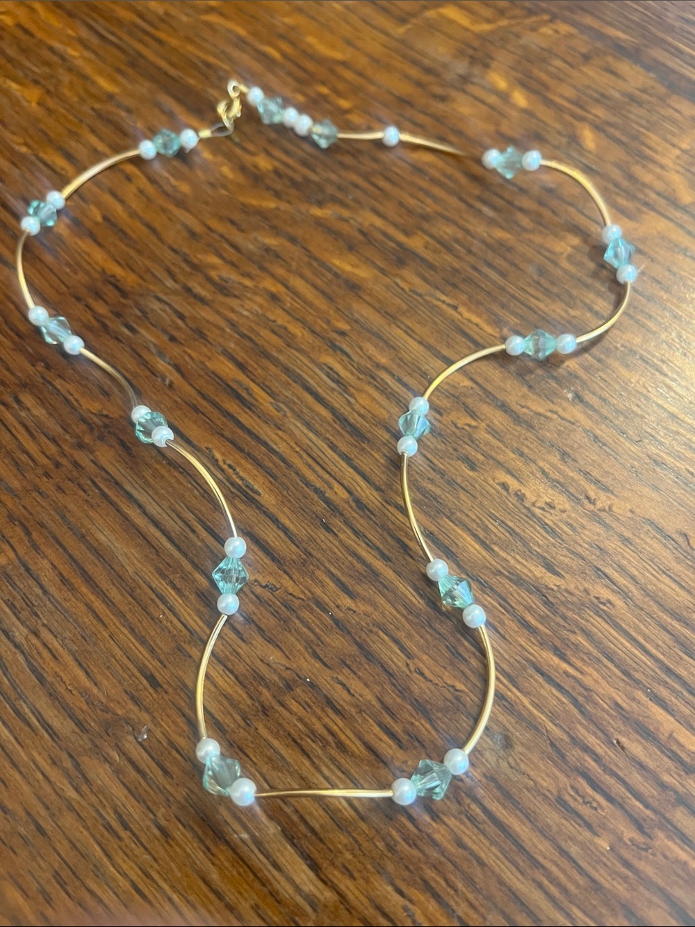 Gold and green and white beaded necklace